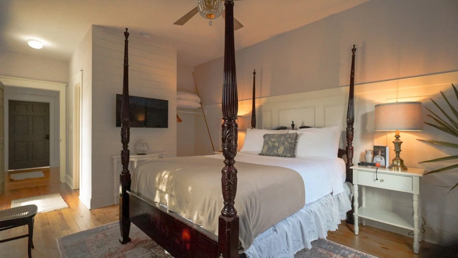 Antique four-poster bed in a Thurston House suite